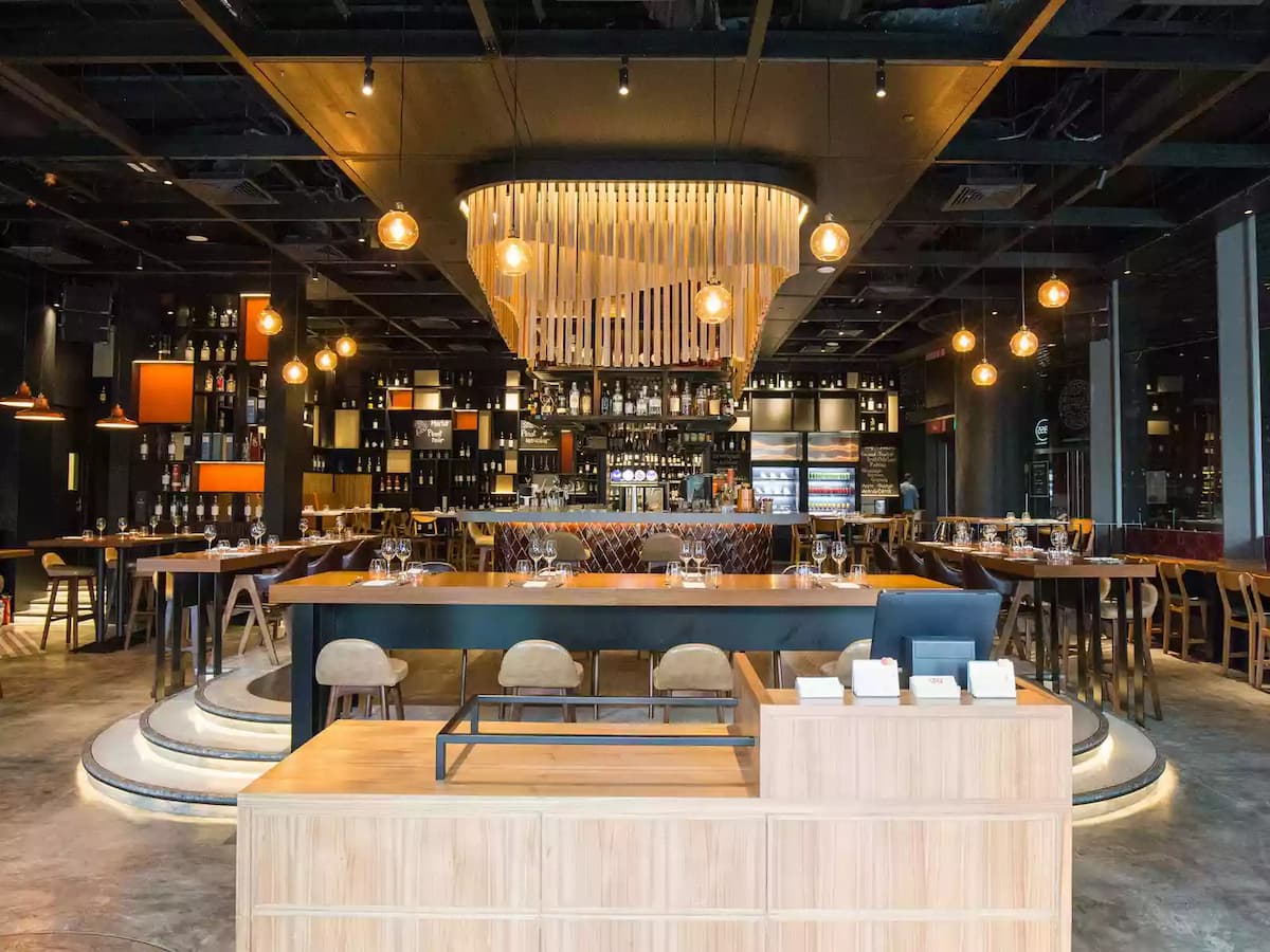 business reception venue in singapore with modern style restaurant with yellow pendant lights