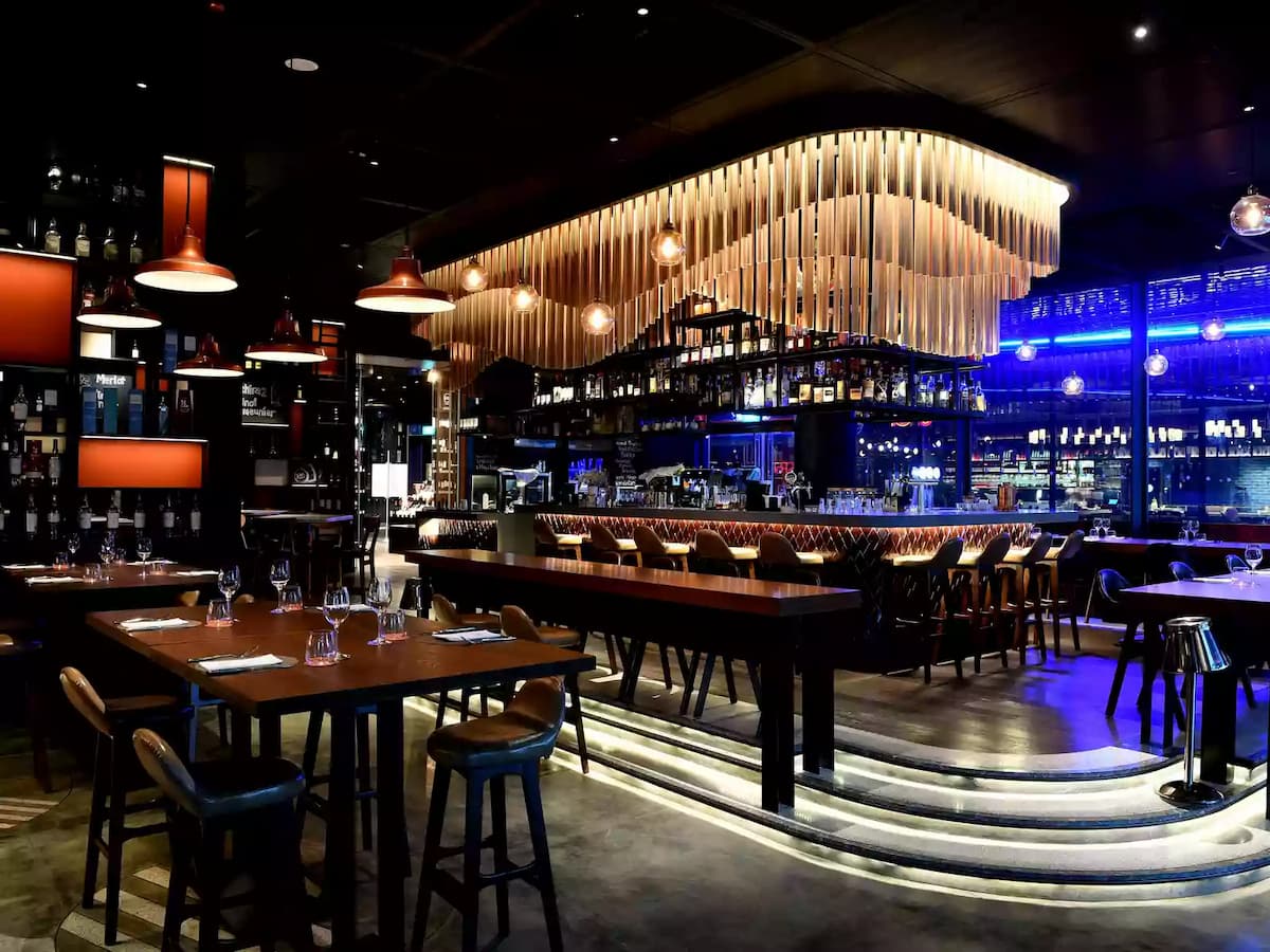 restaurant with a mini staircase to the dining area for business networking event